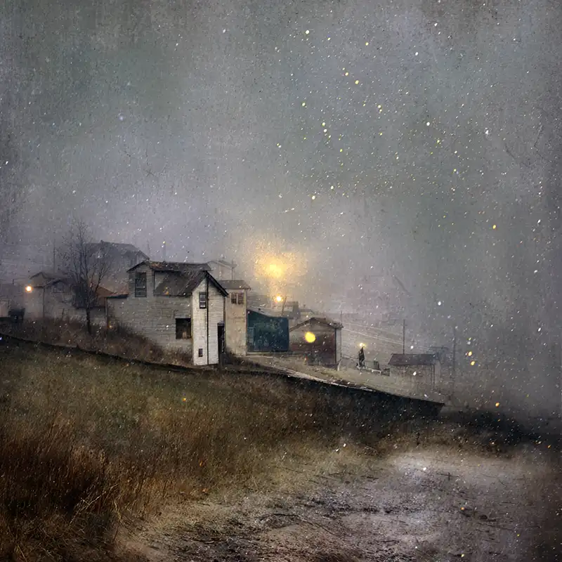 image1 Plot Fragments A row of small houses sits on a misty, sloped hillside under cloudy skies. Warm streetlights glow softly through the fog, and faint specks resembling snow or rain fall in the dim, moody atmosphere.